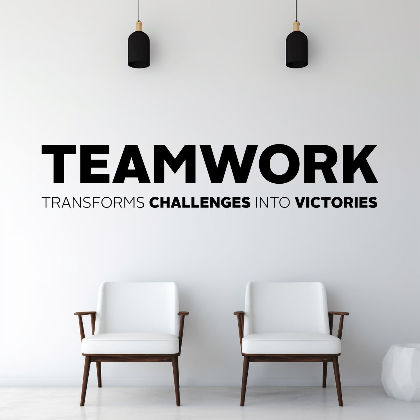 Two white chairs in a minimalistic room with motivational quote on the wall.