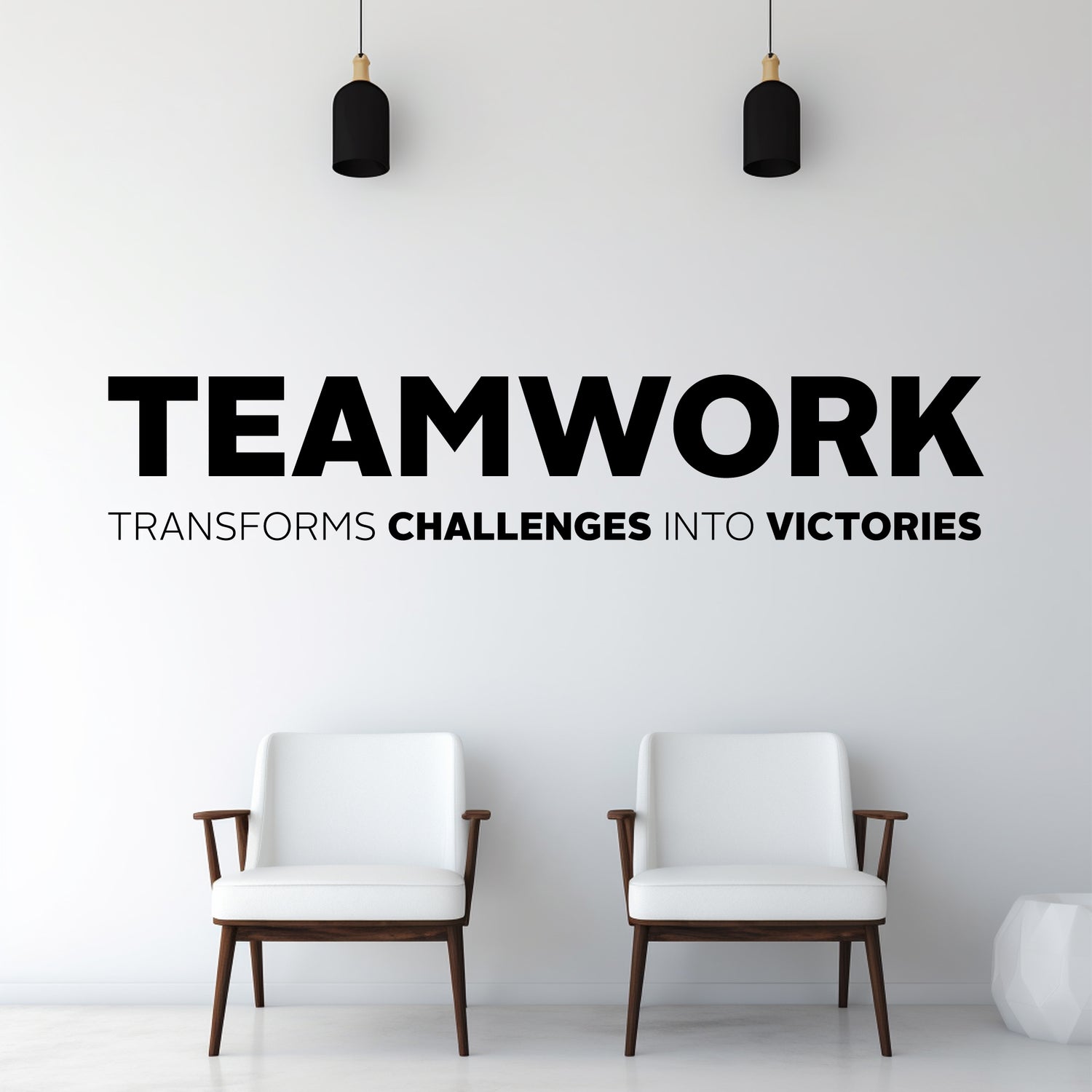 Two white chairs in a minimalistic room with motivational quote on the wall.