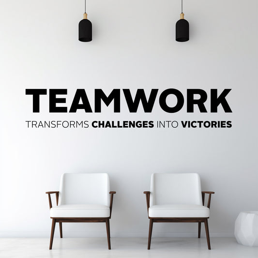 Two white chairs in a minimalistic room with motivational quote on the wall.