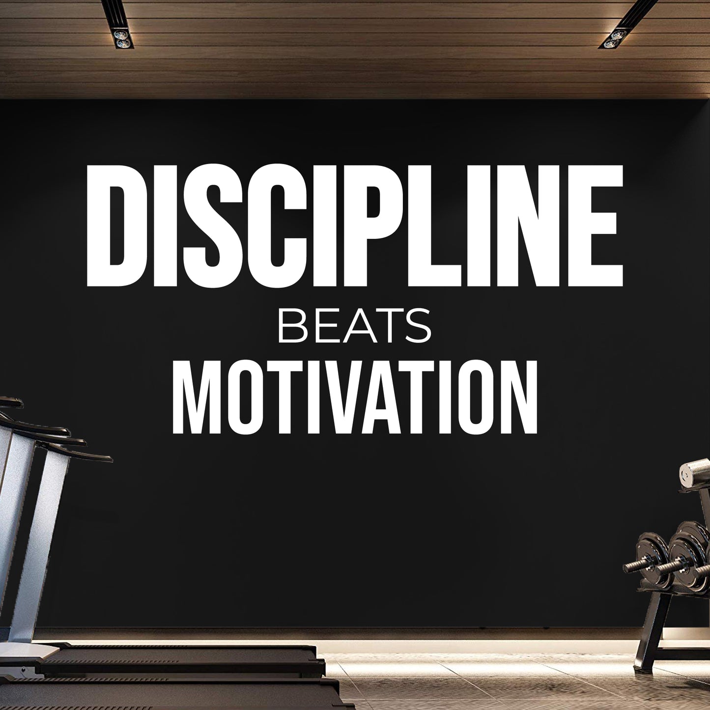 Gym interior with 'Discipline Beats Motivation' motivational quote on a black wall.