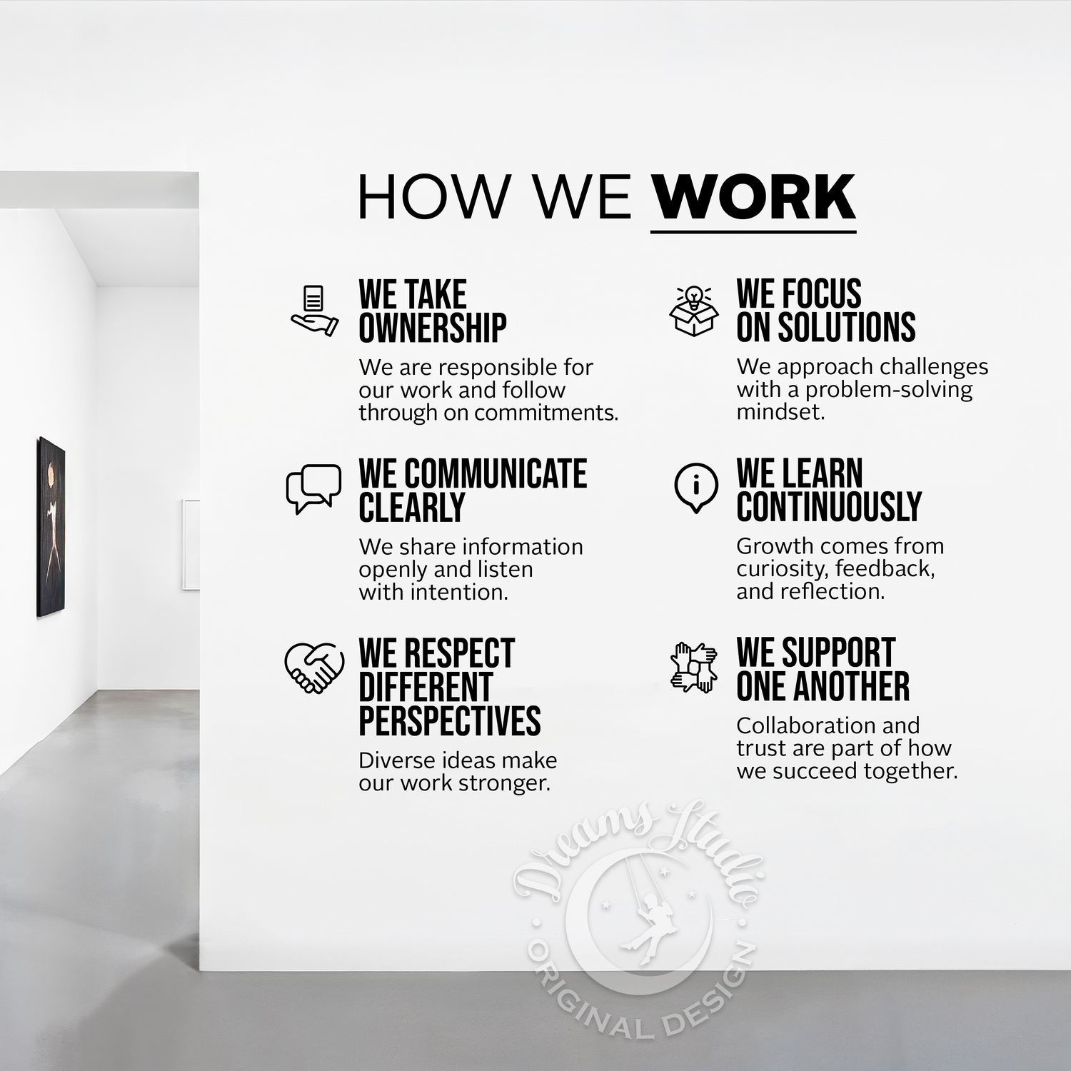 Wall with 'How We Work' principles displayed in a modern office setting