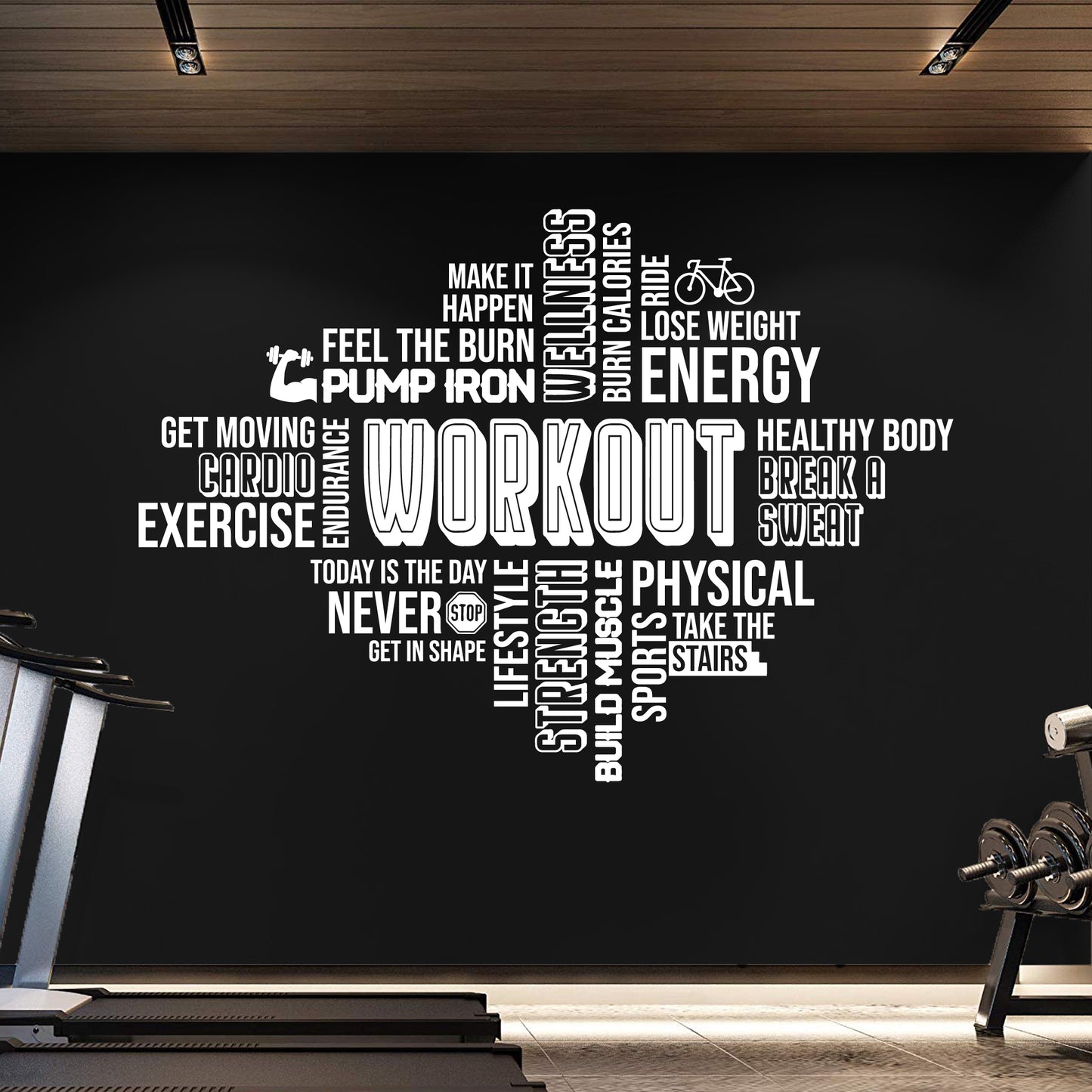 Gym interior with motivational fitness wall decal on a black wall.