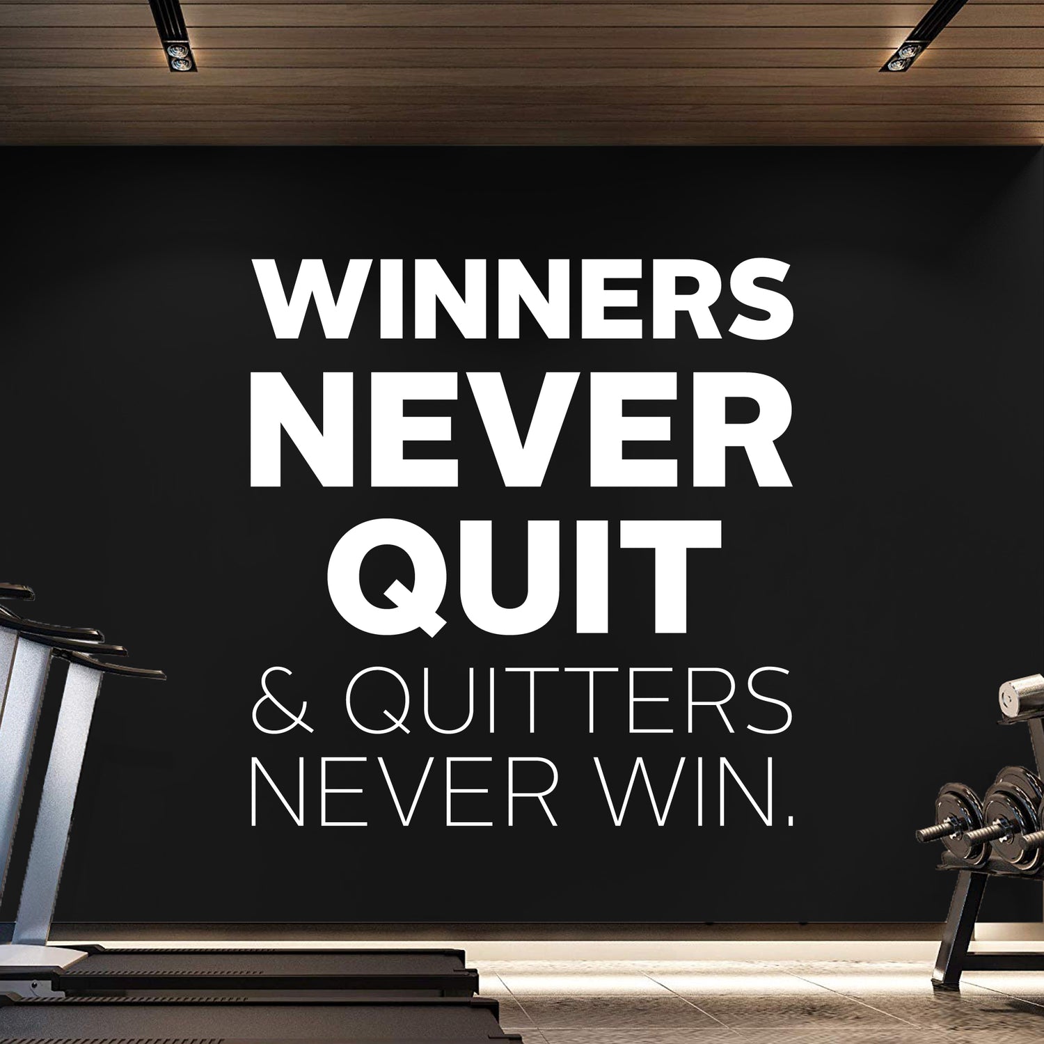 Motivational quote 'Winners Never Quit & Quitters Never Win' on a black wall in a gym setting.