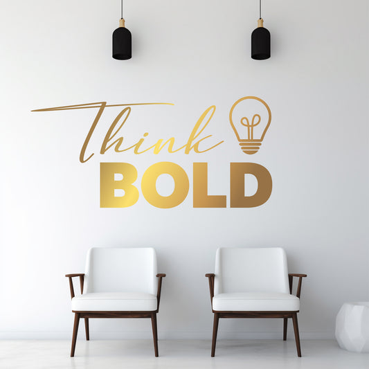 Two white chairs in a room with a gold 'Think Bold' wall decal.