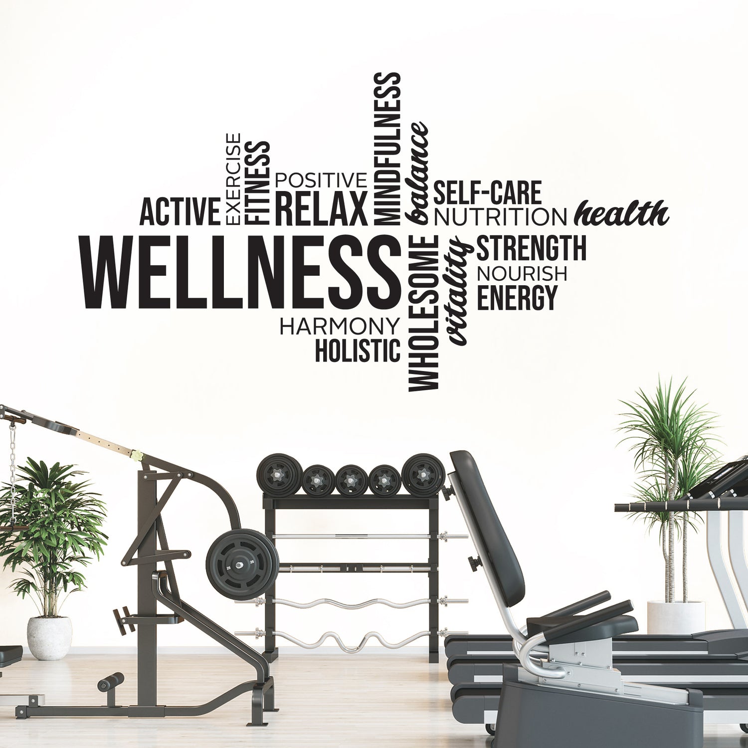 Gym interior with wellness-themed wall decal featuring motivational words.