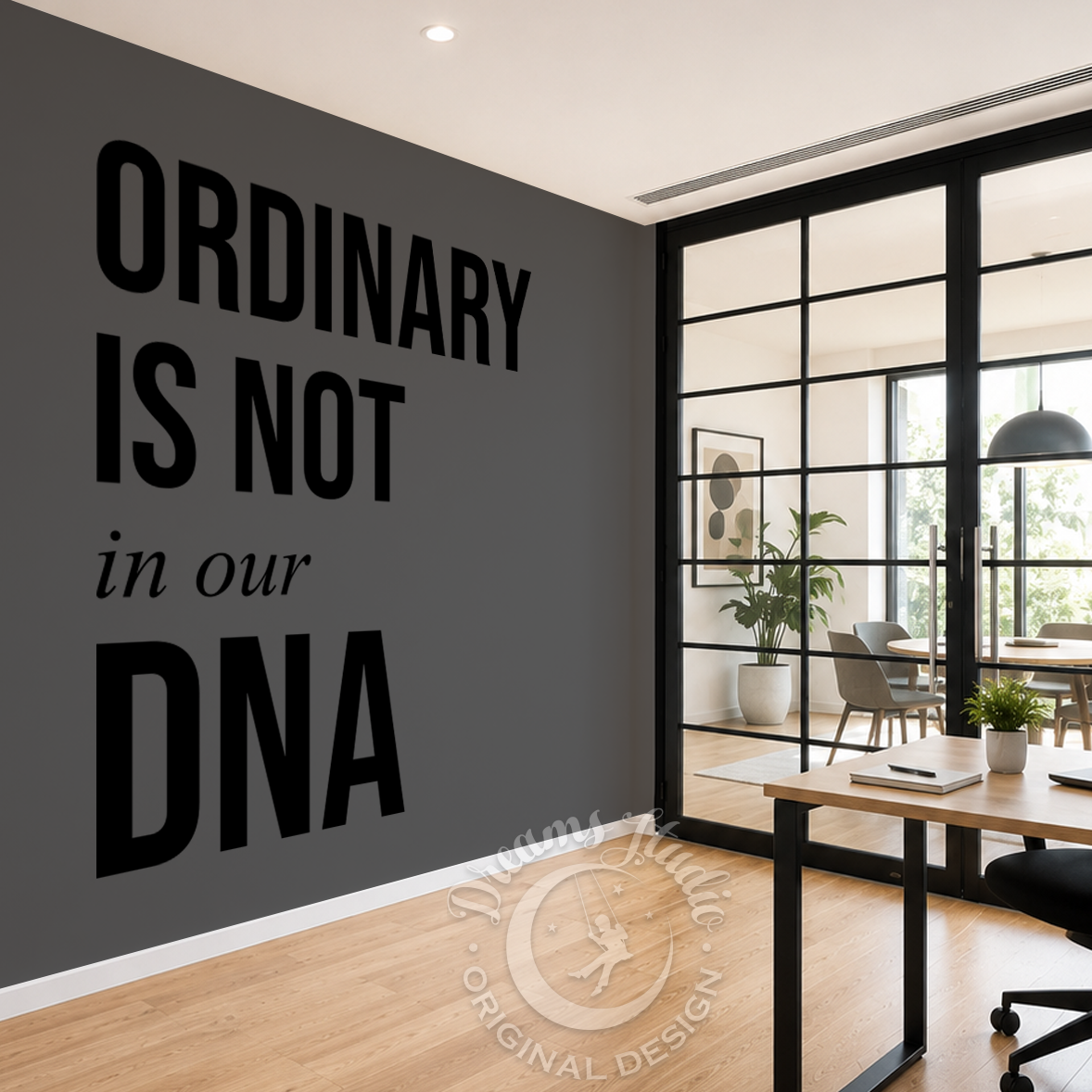 Modern office interior with motivational quote on wall and desk setup.
