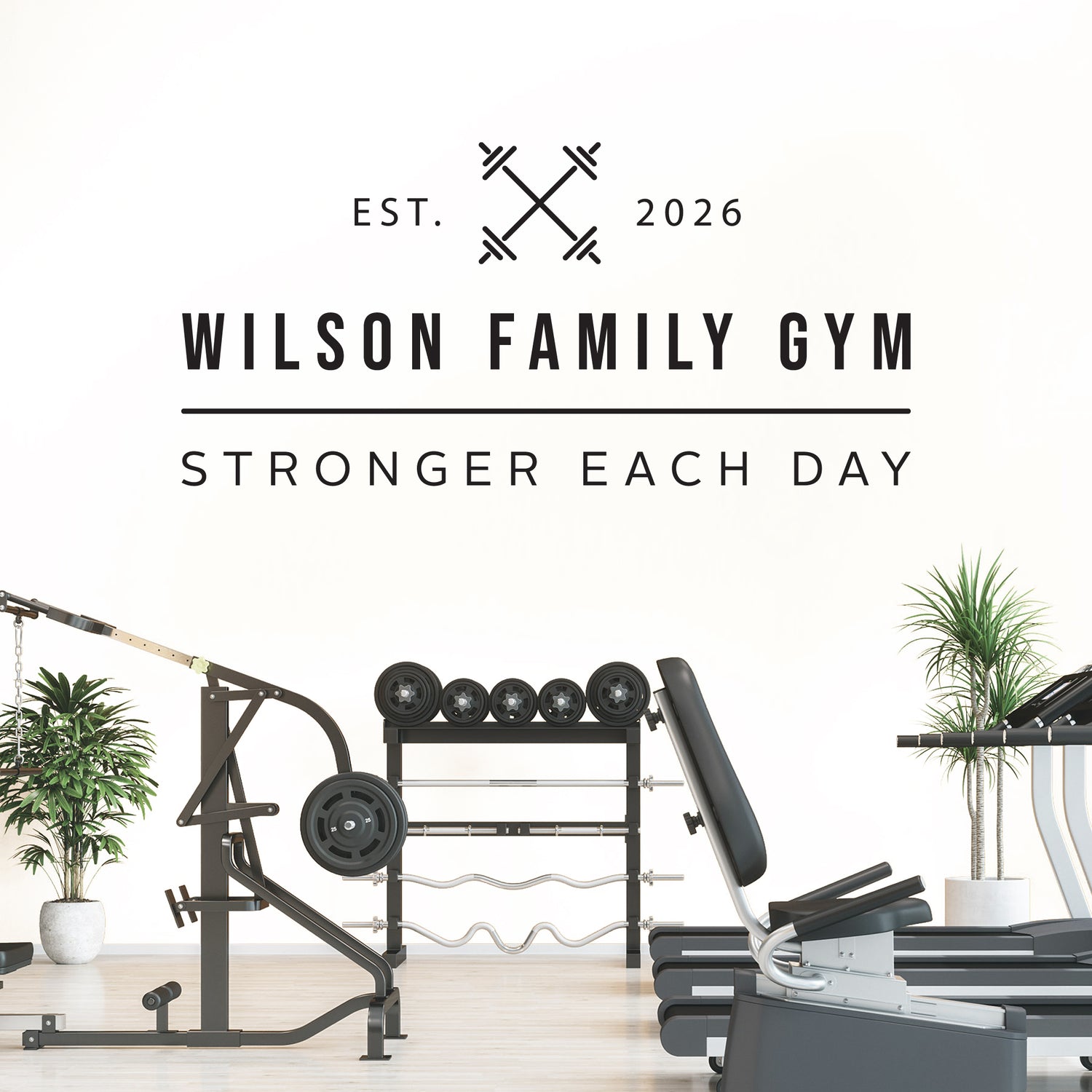 Gym equipment with 'Wilson Family Gym' branding and motivational quote on a white background