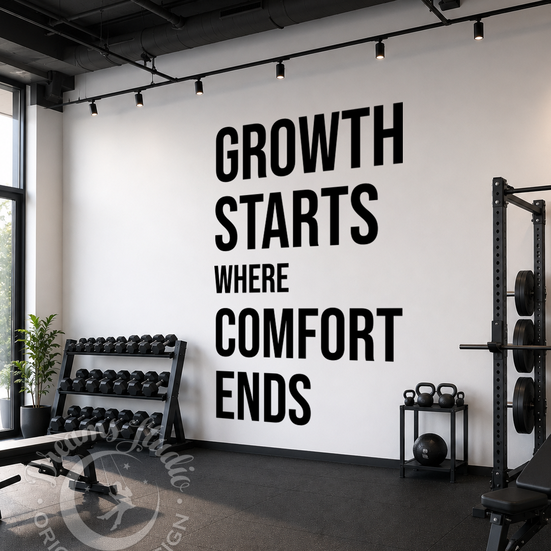 Gym interior with motivational quote on wall, dumbbells, and fitness equipment.