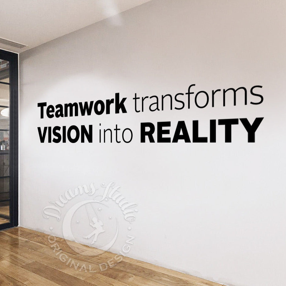 Wall with motivational quote 'Teamwork transforms Vision into Reality' in a modern office setting.