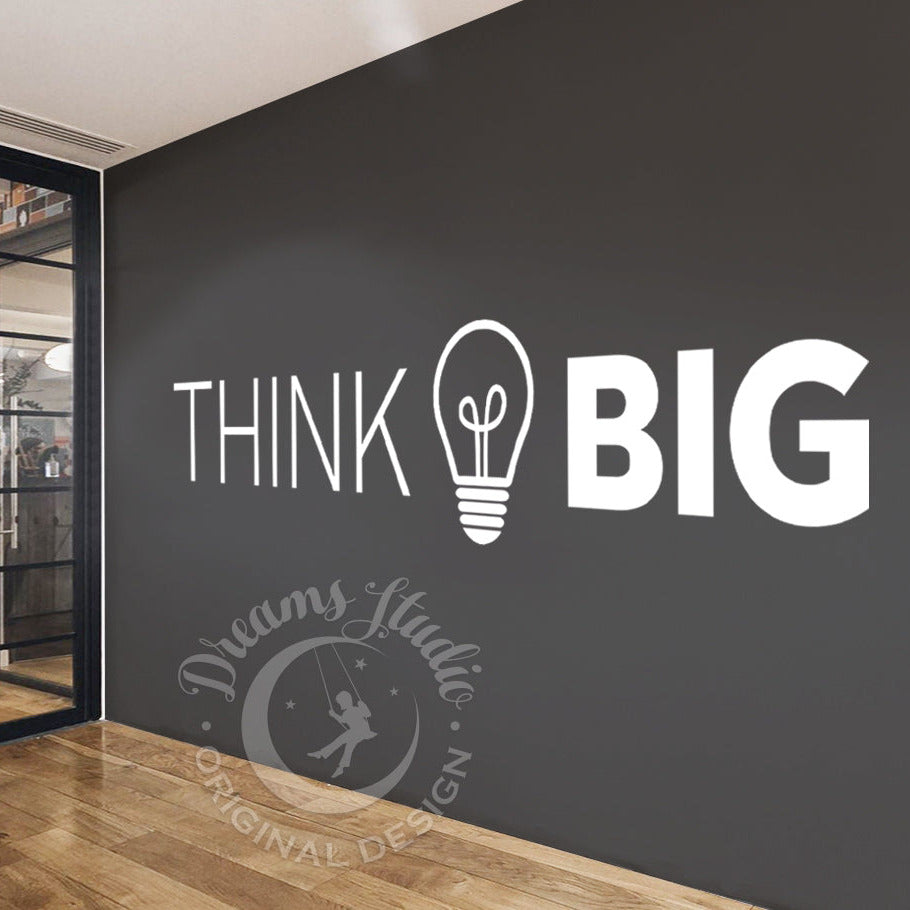 Modern interior with a wall featuring 'Think Big' and 'Dreams Studio' branding.