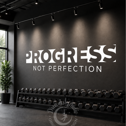 Gym interior with 'Progress Not Perfection' motivational quote on a wall.