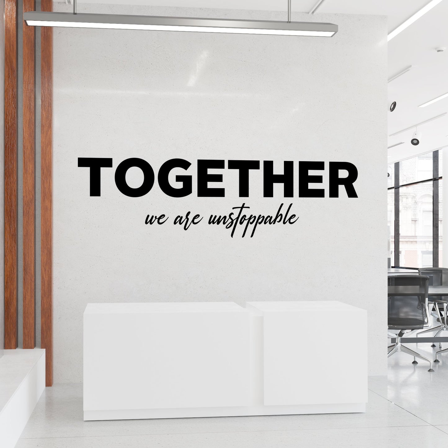 Modern office interior with motivational quote 'Together we are unstoppable' on a wall.