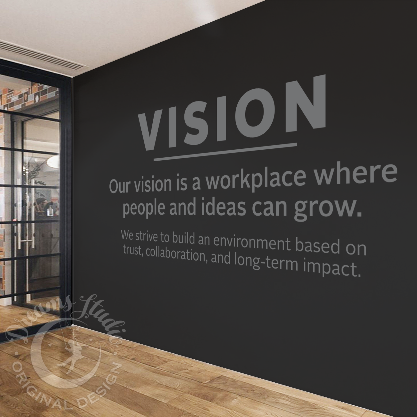 Modern office interior with a black wall featuring motivational text.