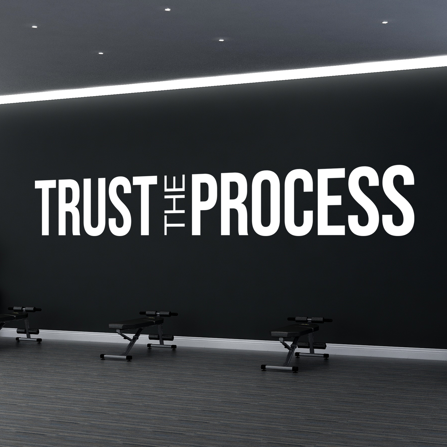 Gym interior with motivational quote 'Trust The Process' on a wall