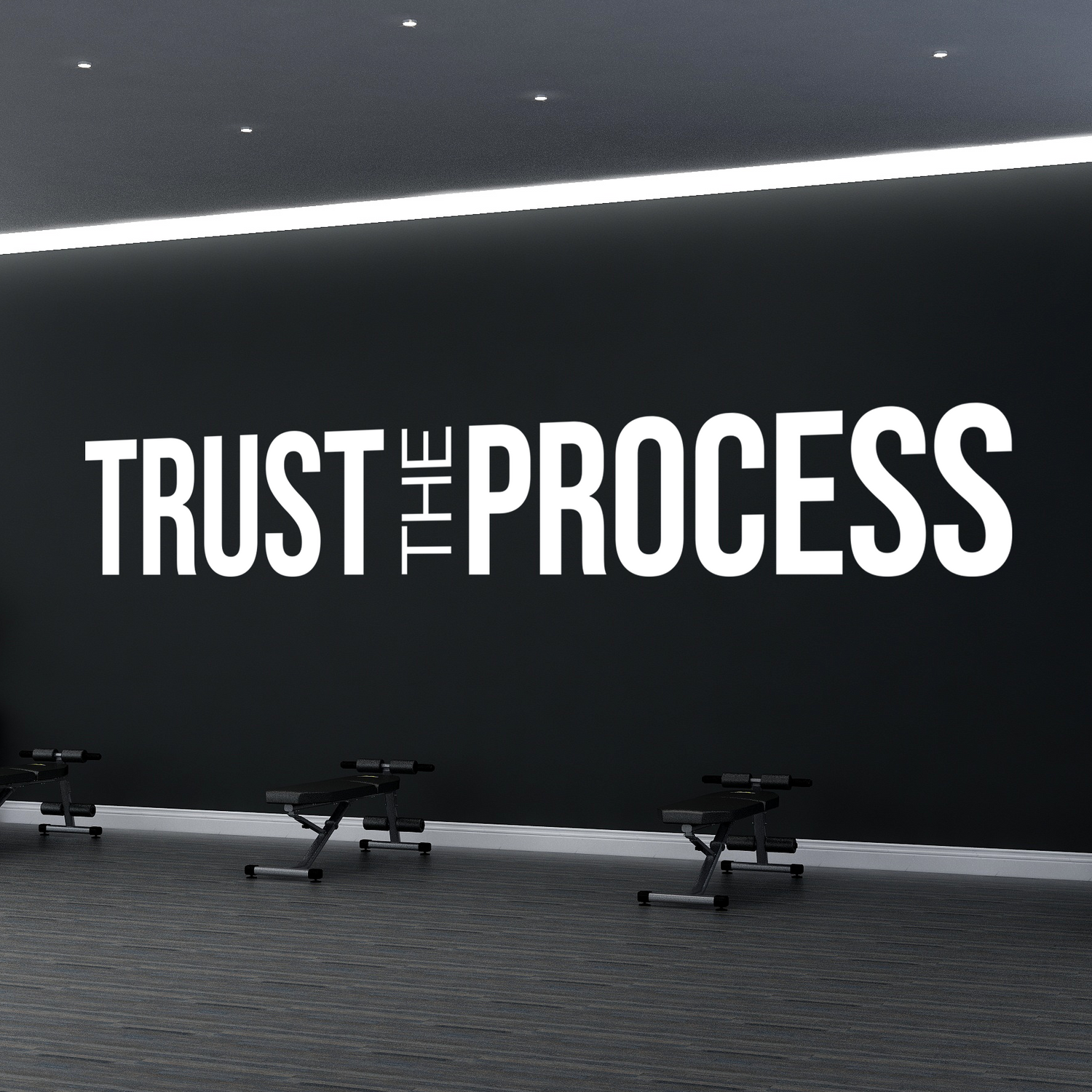 Gym interior with motivational quote 'Trust The Process' on a wall