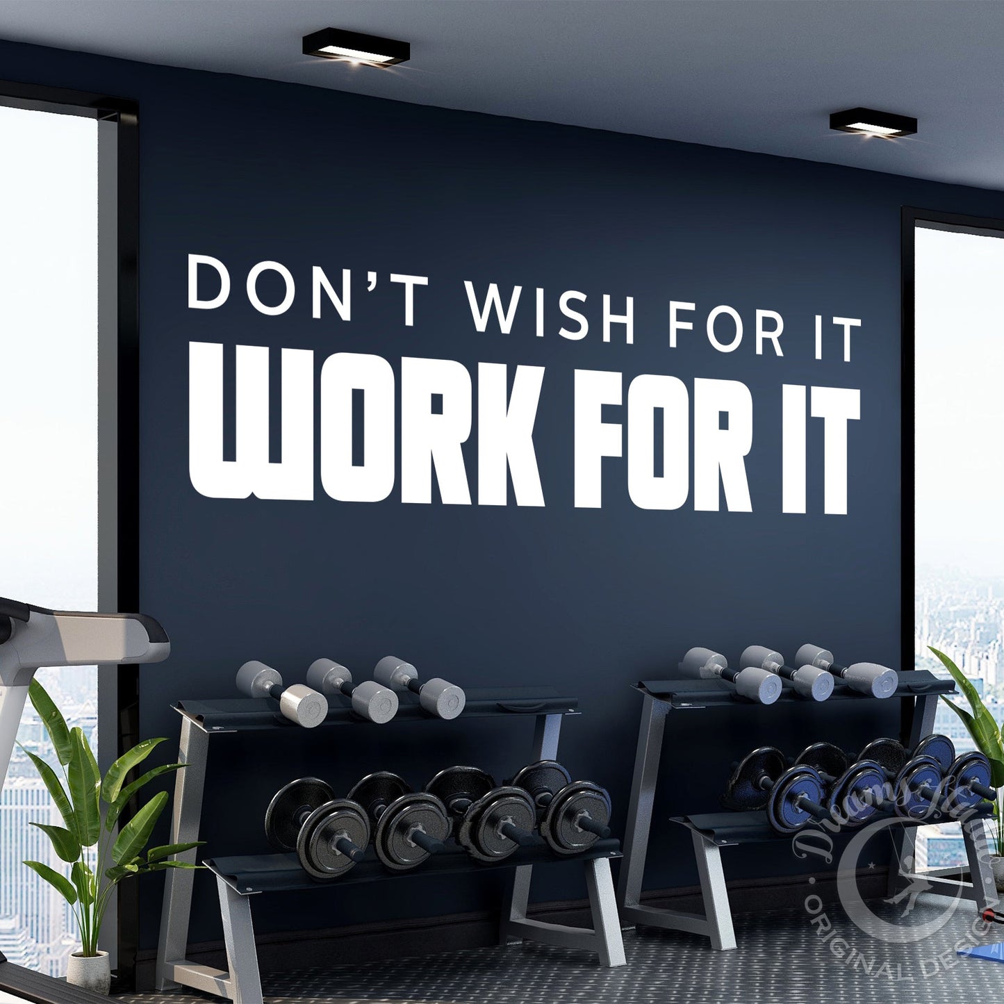 Gym interior with motivational quote on wall, dumbbells, and exercise equipment.