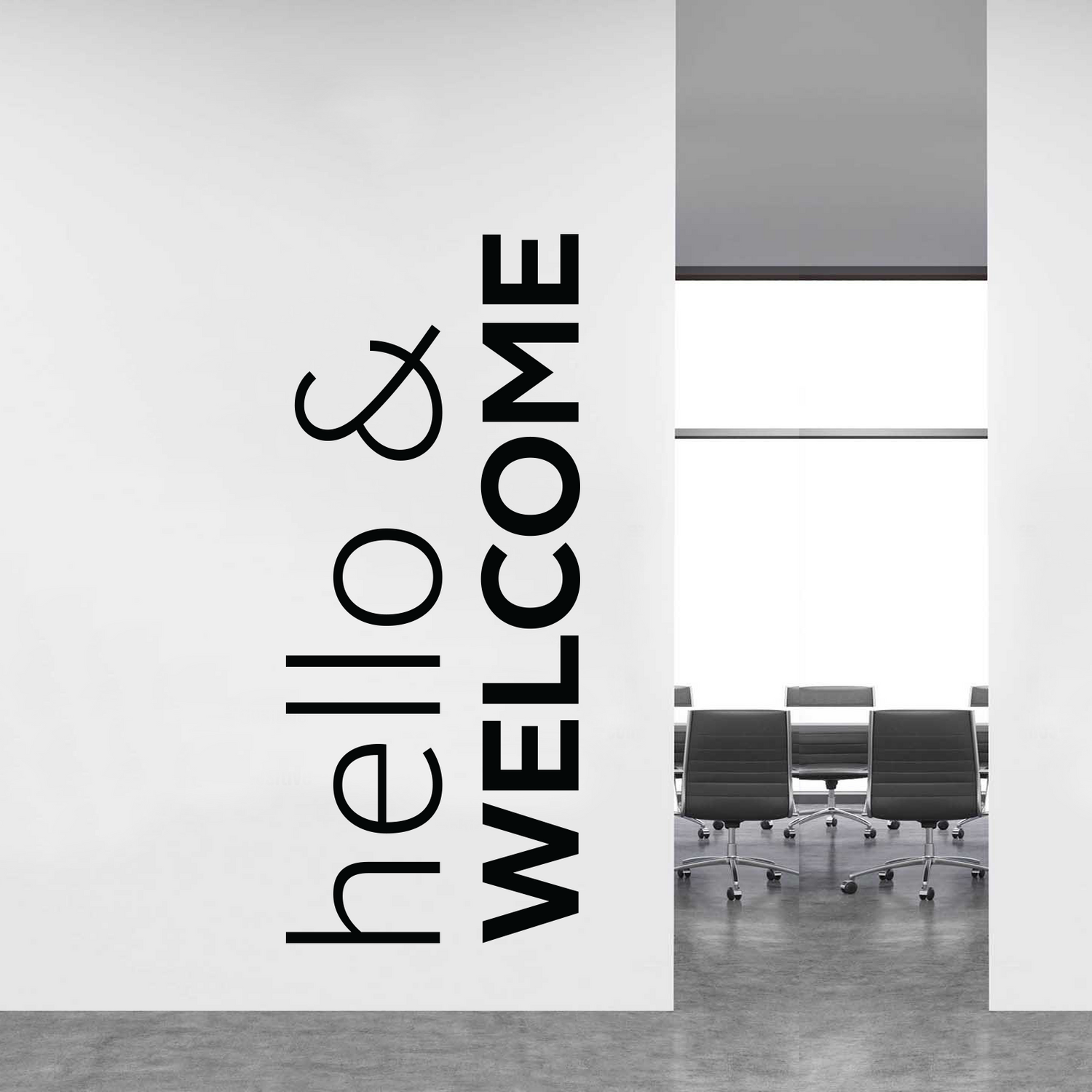 Modern office interior with 'hello & welcome' sign on a white wall.