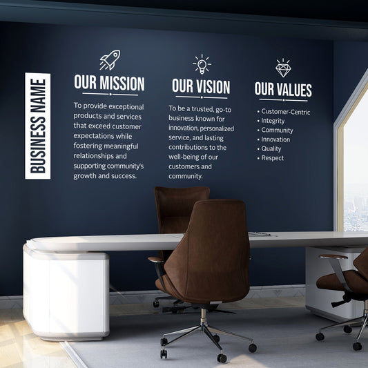 Modern office interior with a wall displaying mission, vision, and values statements.