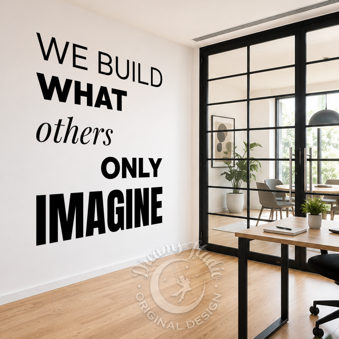 Modern office space with motivational quote on wall and desk setup.