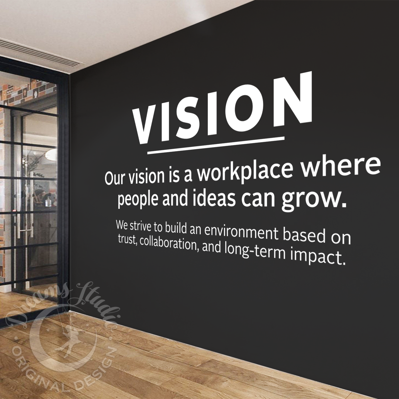 Wall with motivational quote 'VISION' in a modern office setting