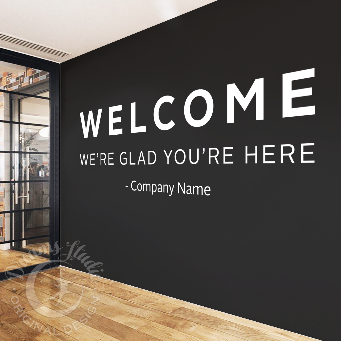 Modern interior with a black wall featuring a welcome message.