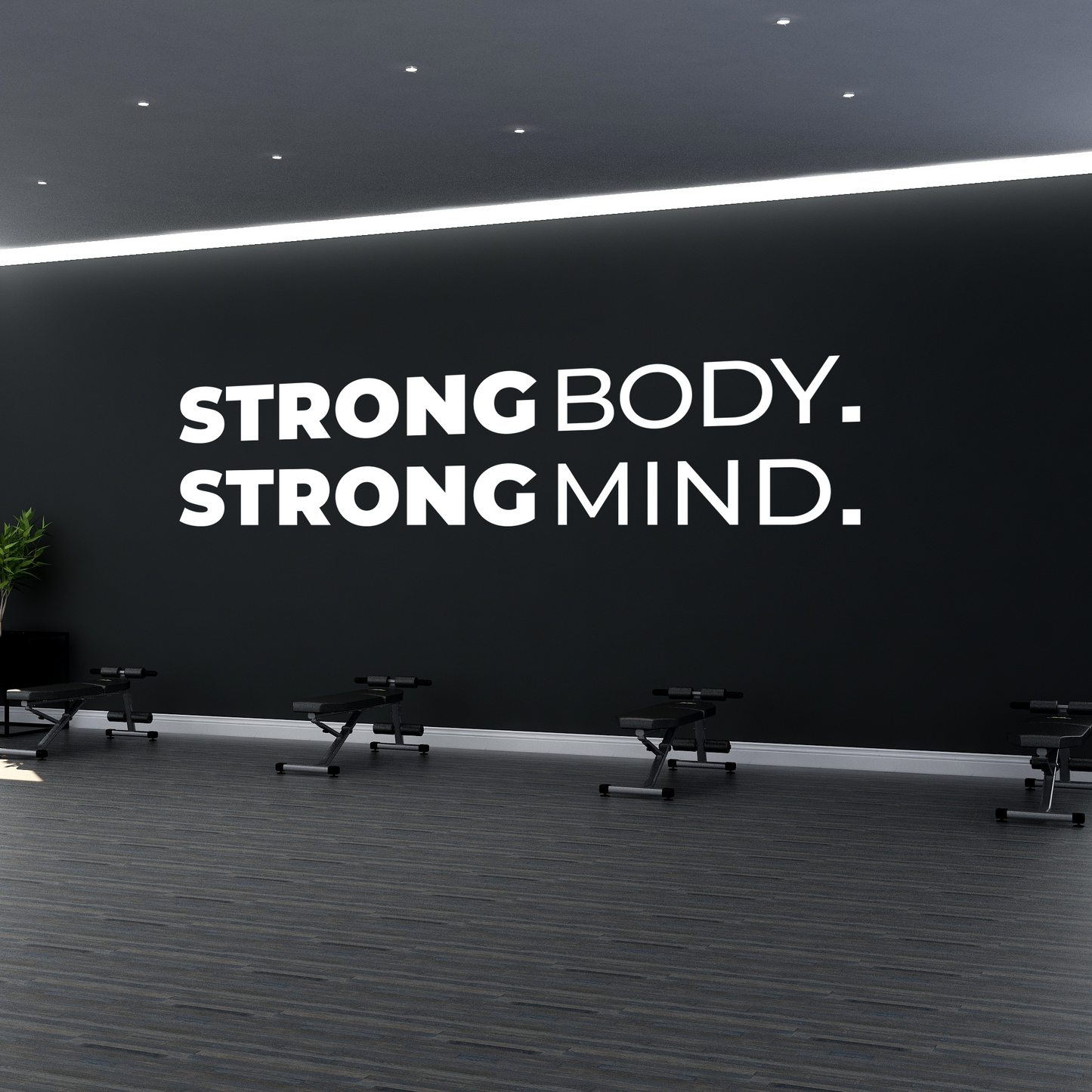 Gym interior with motivational quote 'Strong Body. Strong Mind.' on a wall.