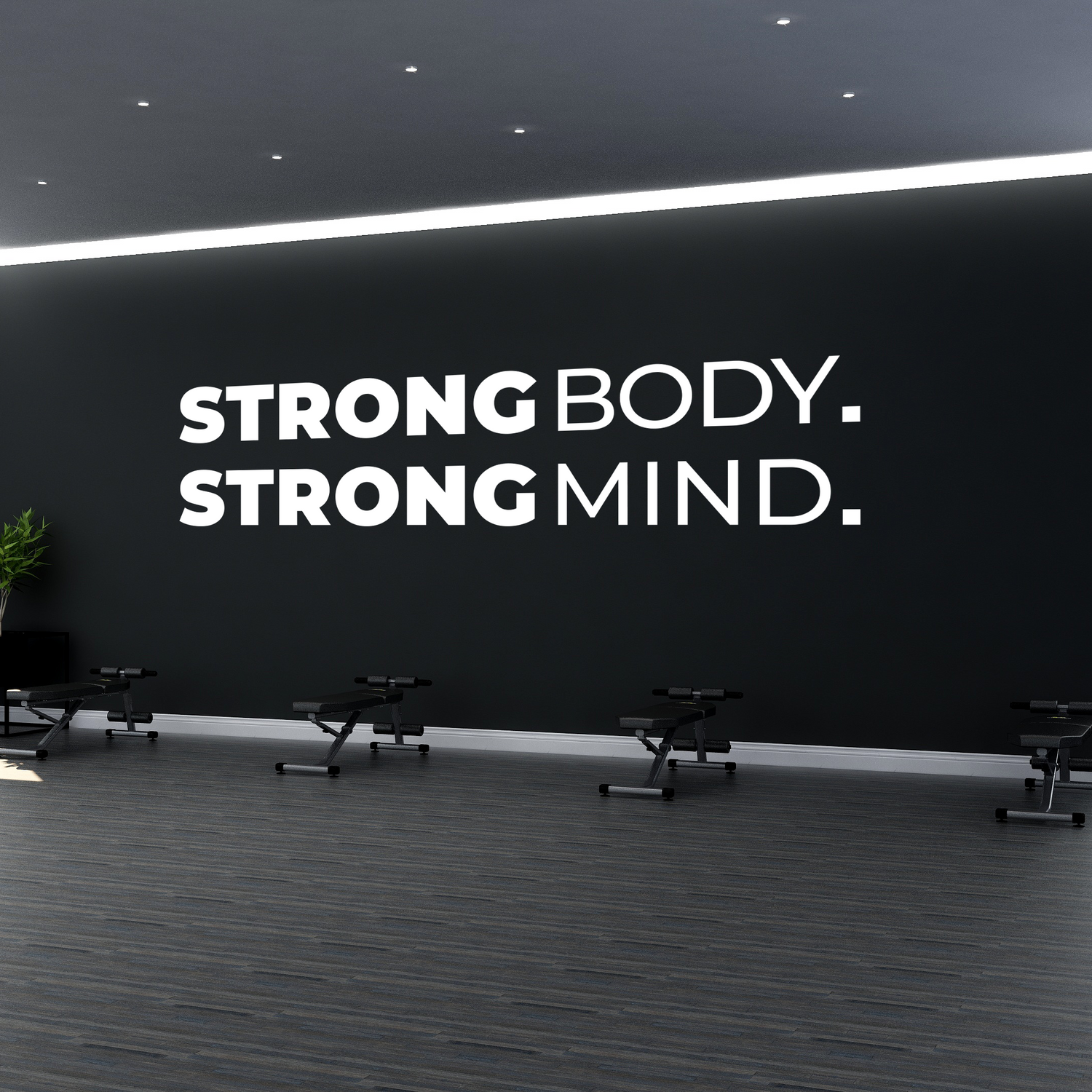 Gym interior with motivational quote 'Strong Body. Strong Mind.' on a wall.
