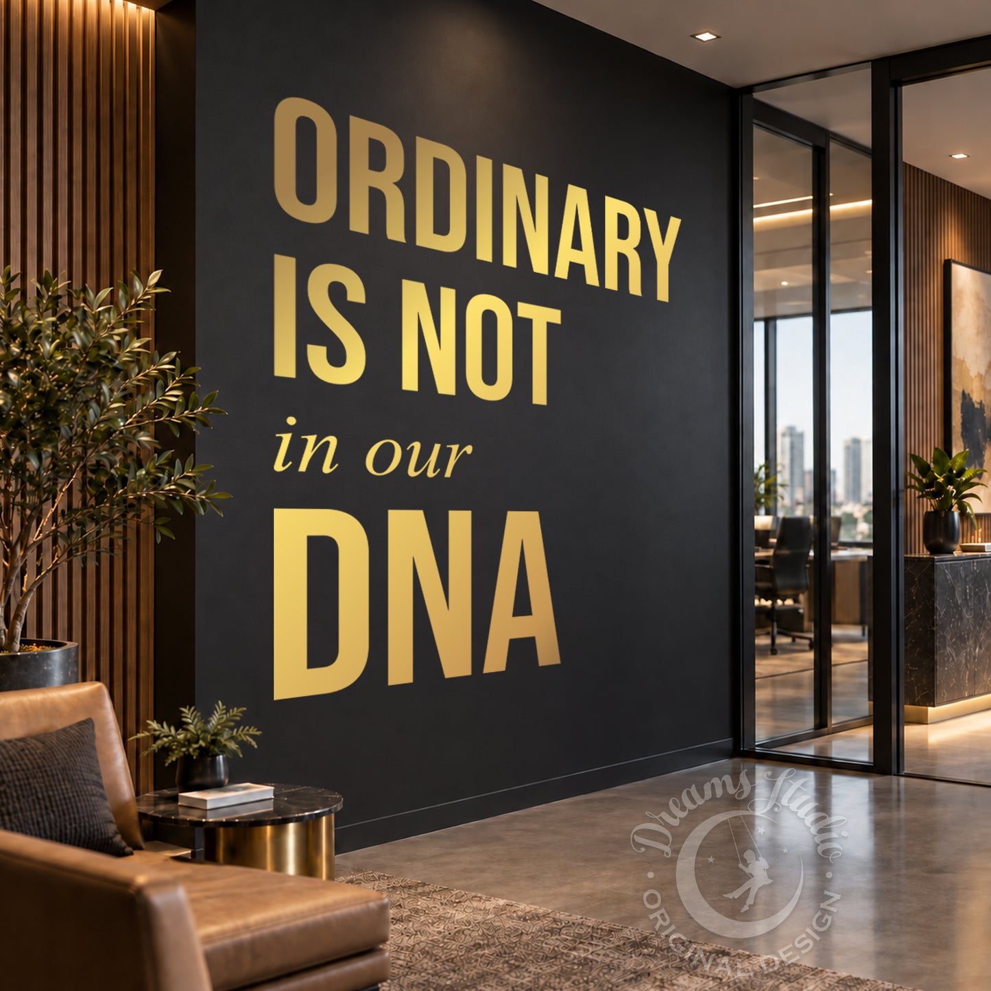 A modern interior space with a dark charcoal wall featuring large gold text that reads “ORDINARY IS NOT in our DNA.” The room includes a brown leather chair, small side table, potted plant, wood slat wall paneling, and glass doors leading to an office area.