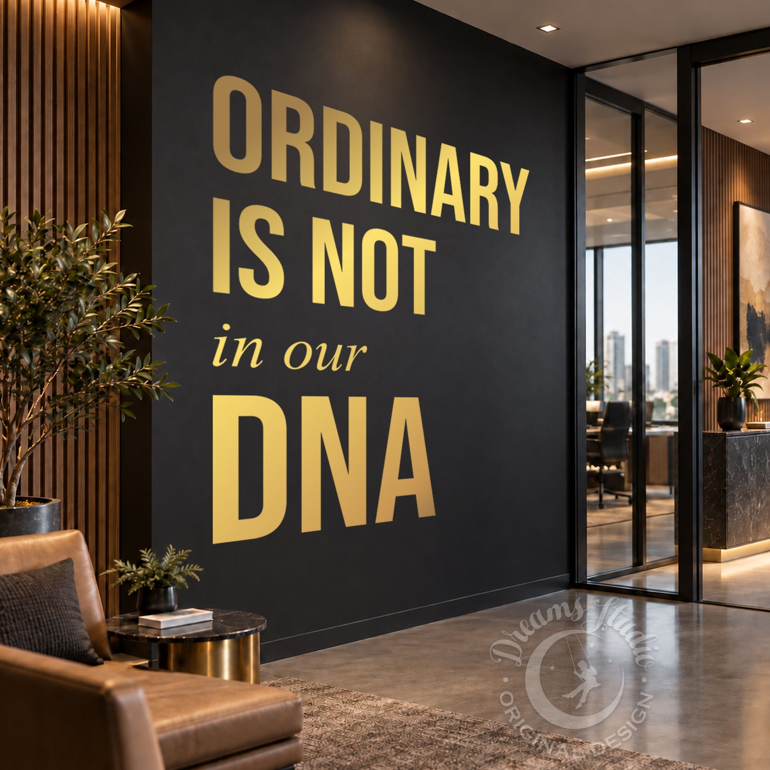 A modern interior space with a dark charcoal wall featuring large gold text that reads “ORDINARY IS NOT in our DNA.” The room includes a brown leather chair, small side table, potted plant, wood slat wall paneling, and glass doors leading to an office area.