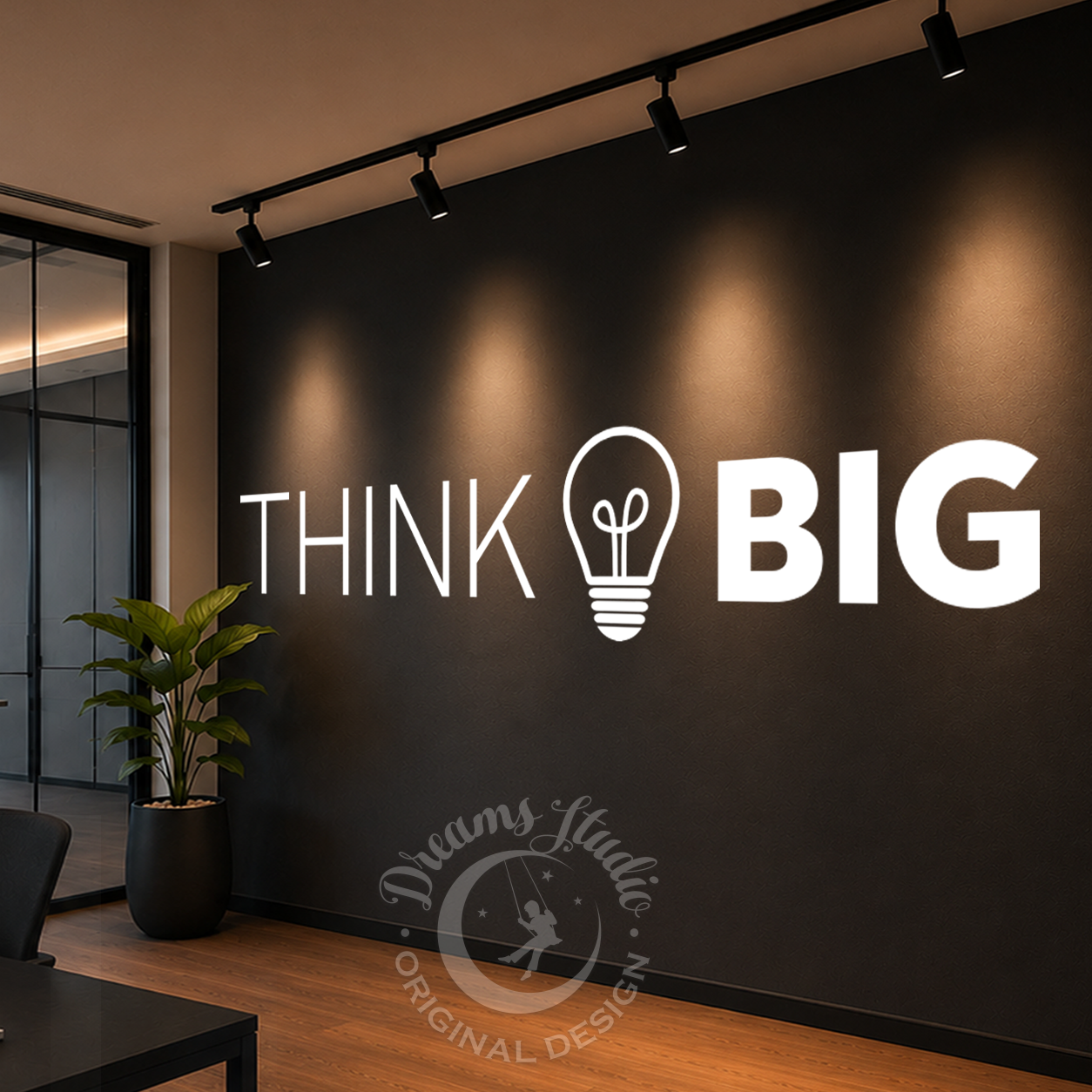 Modern office interior with 'Think Big' motivational quote on a dark wall.