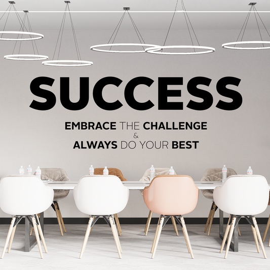 Modern office setting with motivational quote on the wall