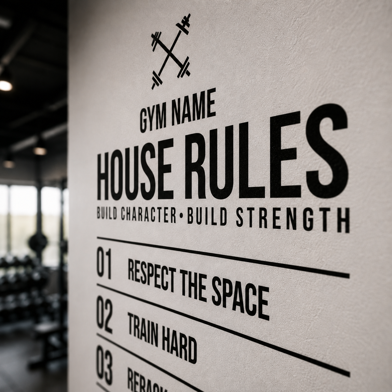 A close-up of a white wall in a gym setting with black printed text reading 'GYM NAME HOUSE RULES BUILD CHARACTER BUILD STRENGTH' and a list starting with 'RESPECT THE SPACE'.